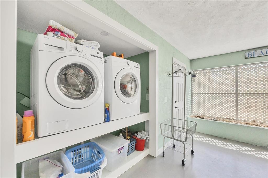 530 5th Street West, Unit 4 Boca Grande, FL 33921 - Photo 37 of 48 a utility room with dryer and washer