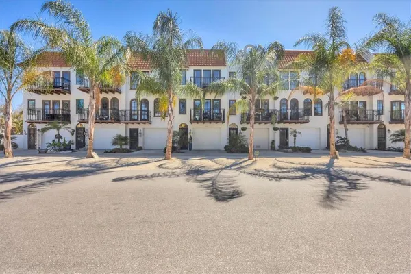 a building with palm trees in front of it