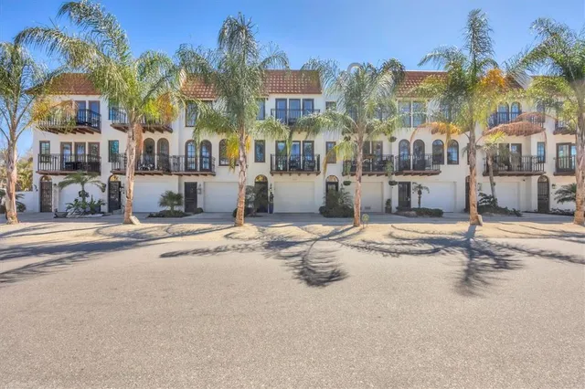 a building with palm trees in front of it