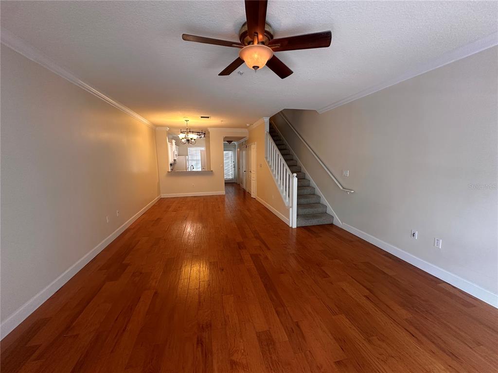 709 Bloom Street, Unit 240 Celebration, FL 34747 - Photo 4 of 17 a view of entryway and hall with wooden floor