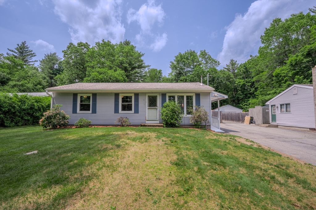 71 Webber Road Brookfield, MA 01506 - Photo 1 of 41 a front view of a house with a garden
