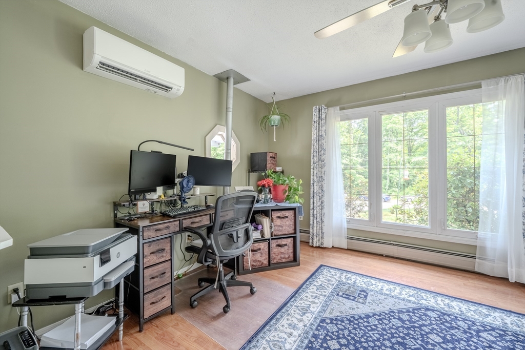 71 Webber Road Brookfield, MA 01506 - Photo 12 of 41 a view of a workspace with furniture and a window