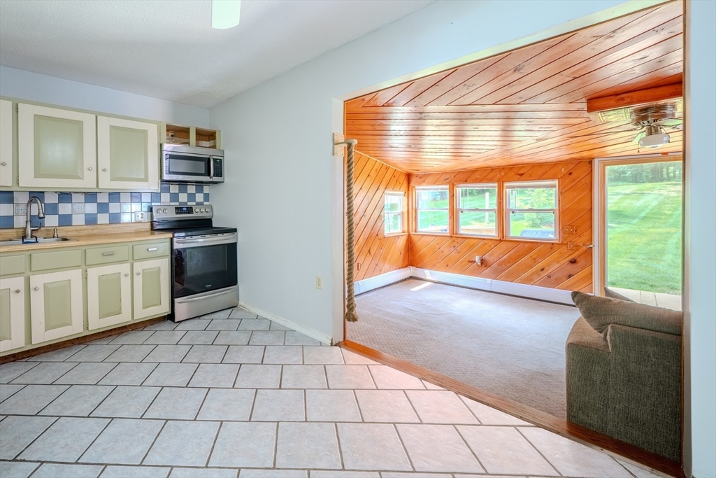 71 Webber Road Brookfield, MA 01506 - Photo 15 of 41 a kitchen with stainless steel appliances a sink and cabinets