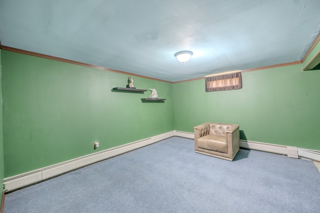 71 Webber Road Brookfield, MA 01506 - Photo 25 of 41 an empty room with wooden floor and windows