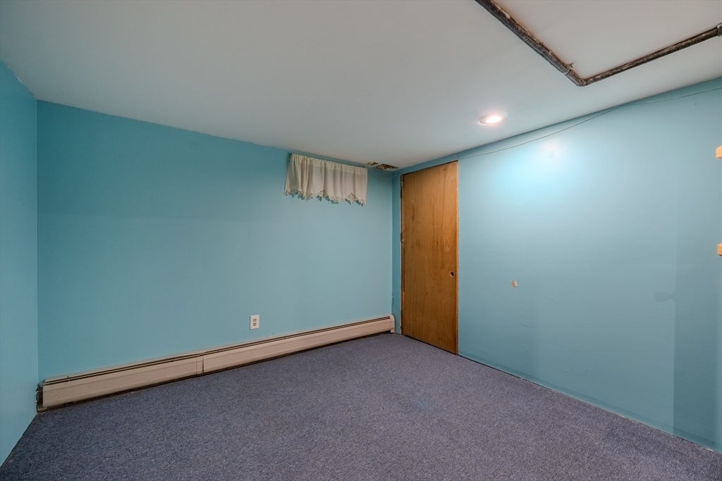 71 Webber Road Brookfield, MA 01506 - Photo 27 of 41 an empty room with a empty space and windows