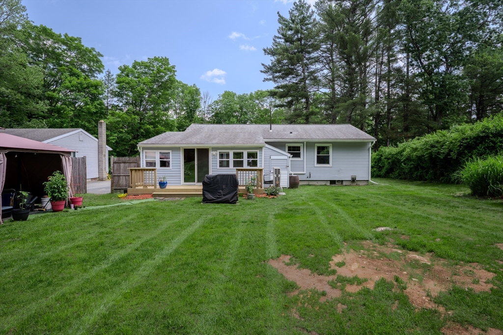 71 Webber Road Brookfield, MA 01506 - Photo 31 of 41 a front view of a house with a yard table and chairs
