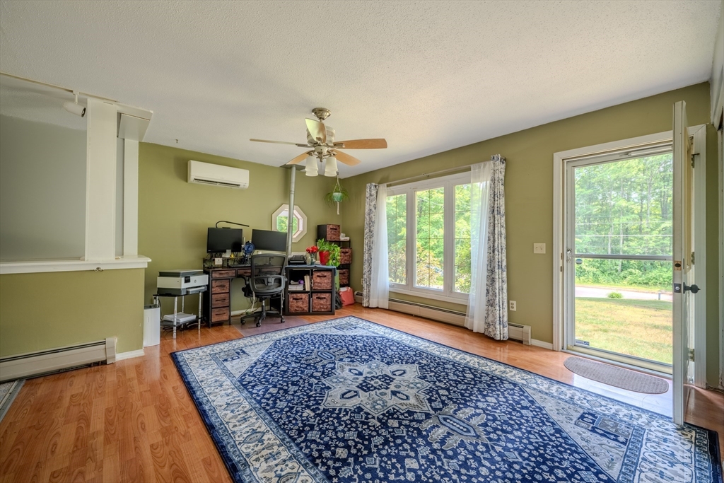71 Webber Road Brookfield, MA 01506 - Photo 10 of 41 a living room with furniture and a large window