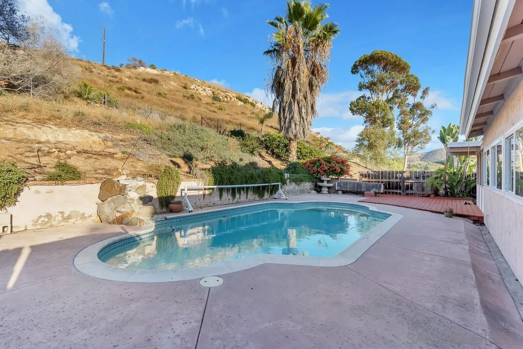 9651 Ramsgate Way Santee, CA 92071 - Photo 28 of 52 a view of a swimming pool with a yard