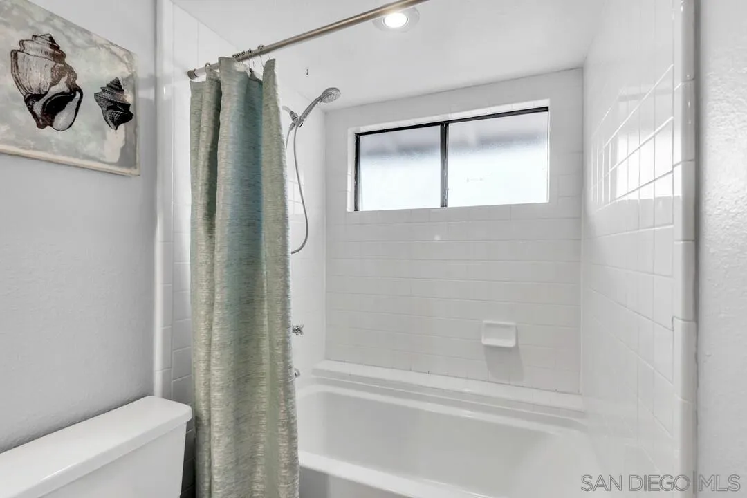 9651 Ramsgate Way Santee, CA 92071 - Photo 41 of 52 a bathroom with a shower and a toilet