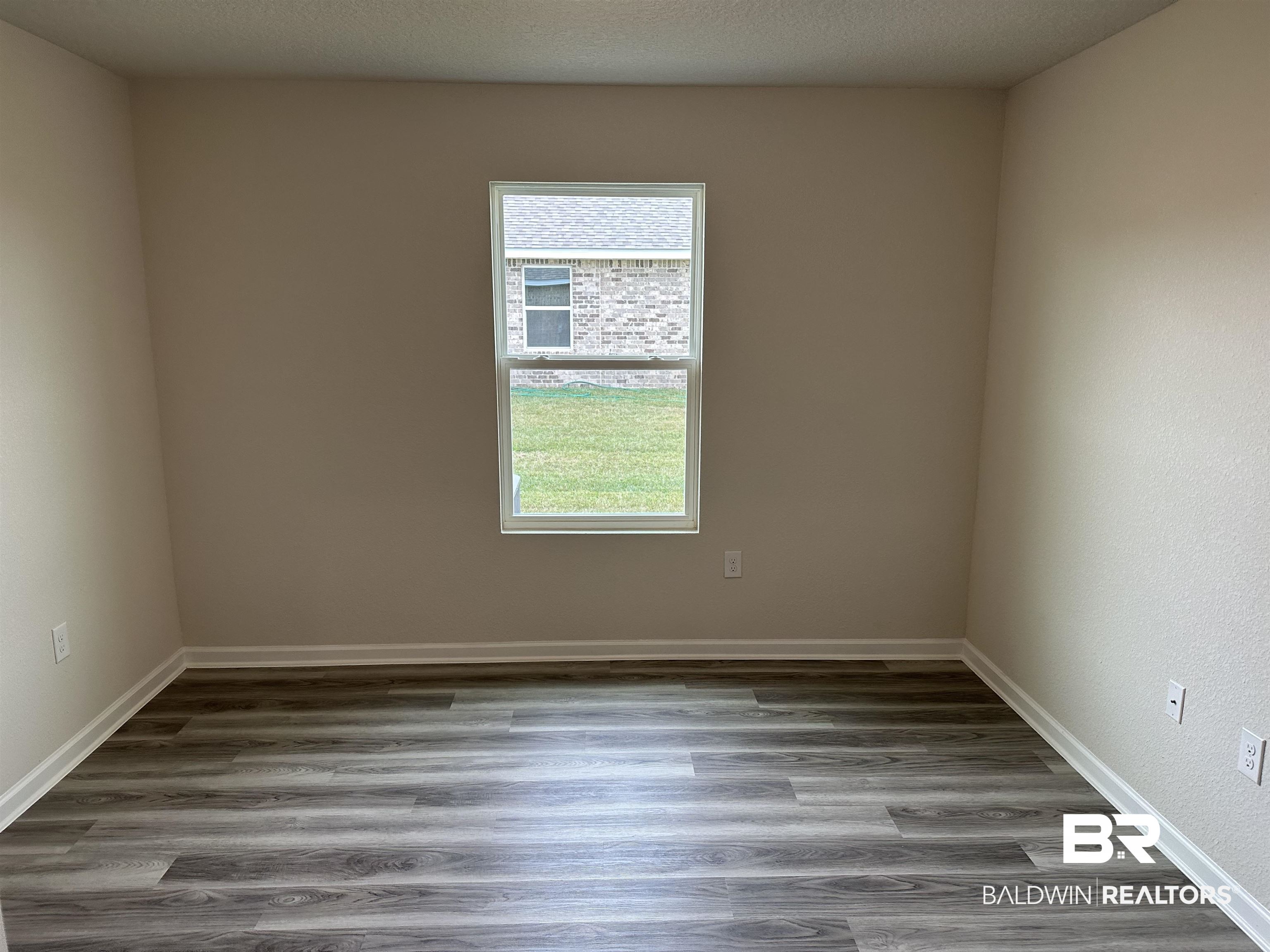 1238 Hayward Loop Foley, AL 36535 - Photo 17 of 46 Empty room featuring hardwood / wood-style floors