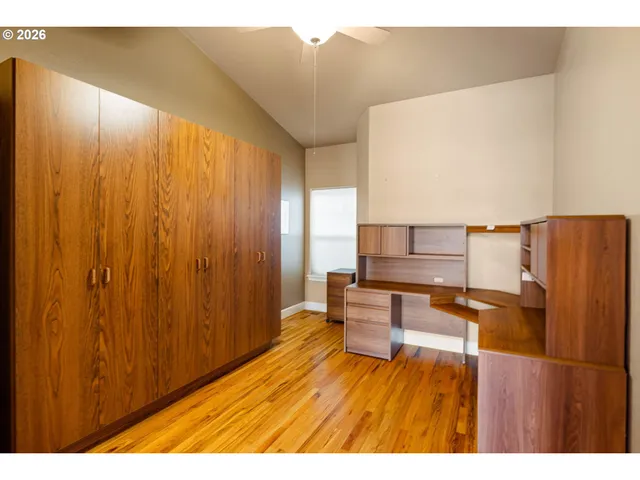 a balcony with wooden floor and furniture