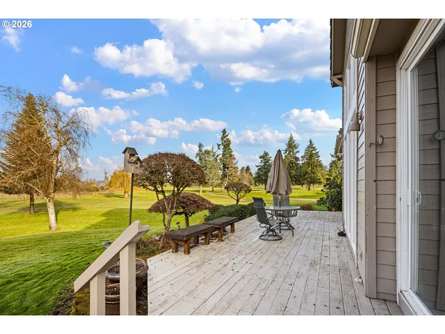 a view of a swimming pool with an outdoor seating and yard