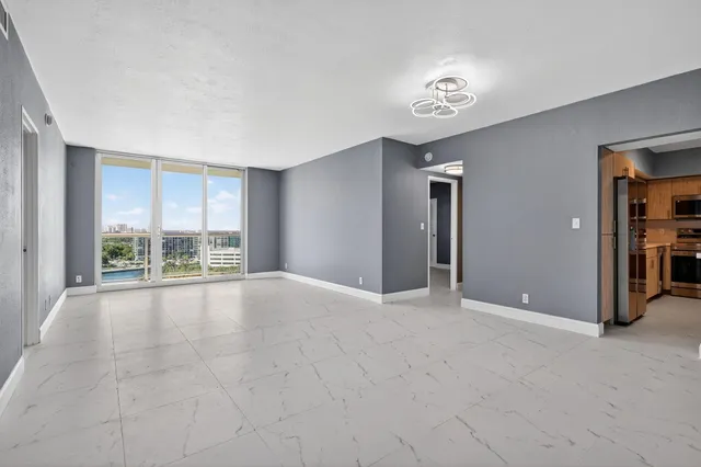 a view of an empty room with a window