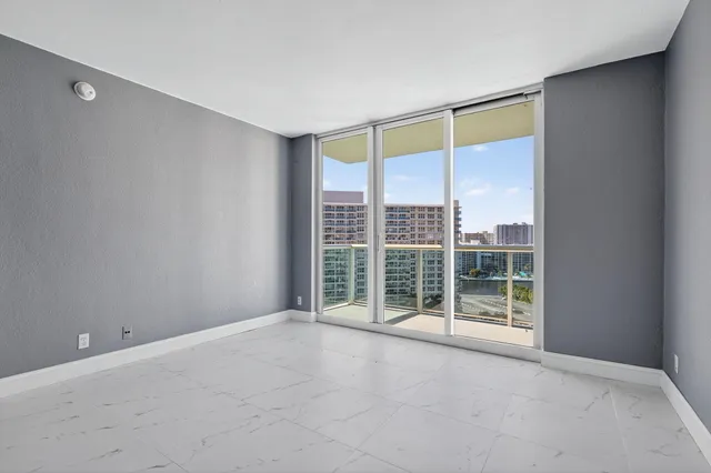 a view of an empty room with a window