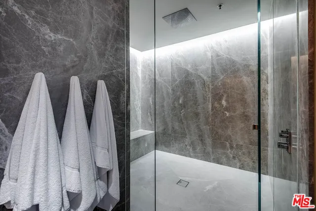 a bathroom with a shower and a tub