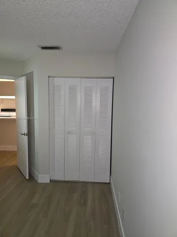 a view of a closet in a room
