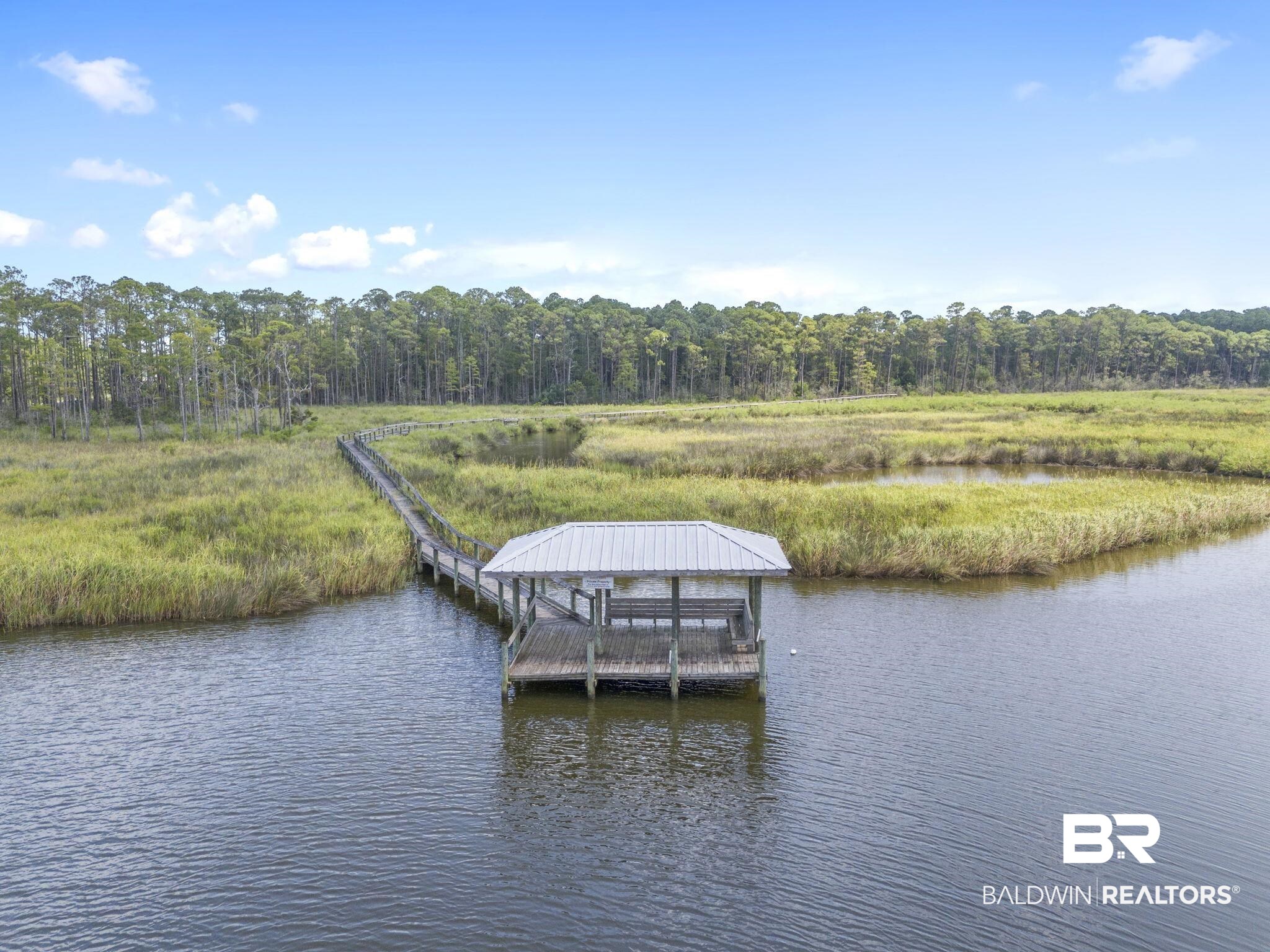 4451 Millhouse Road Gulf Shores, AL 36542 - Photo 48 of 50 Dock area featuring a water view