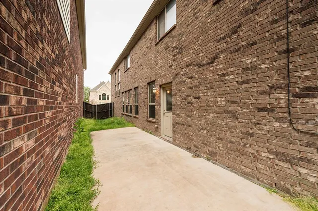 a view of a kitchen with cabinets stainless steel appliances and wooden floor