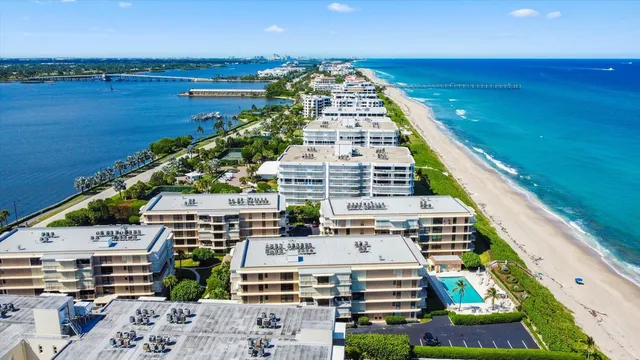 an aerial view of a house with a ocean view