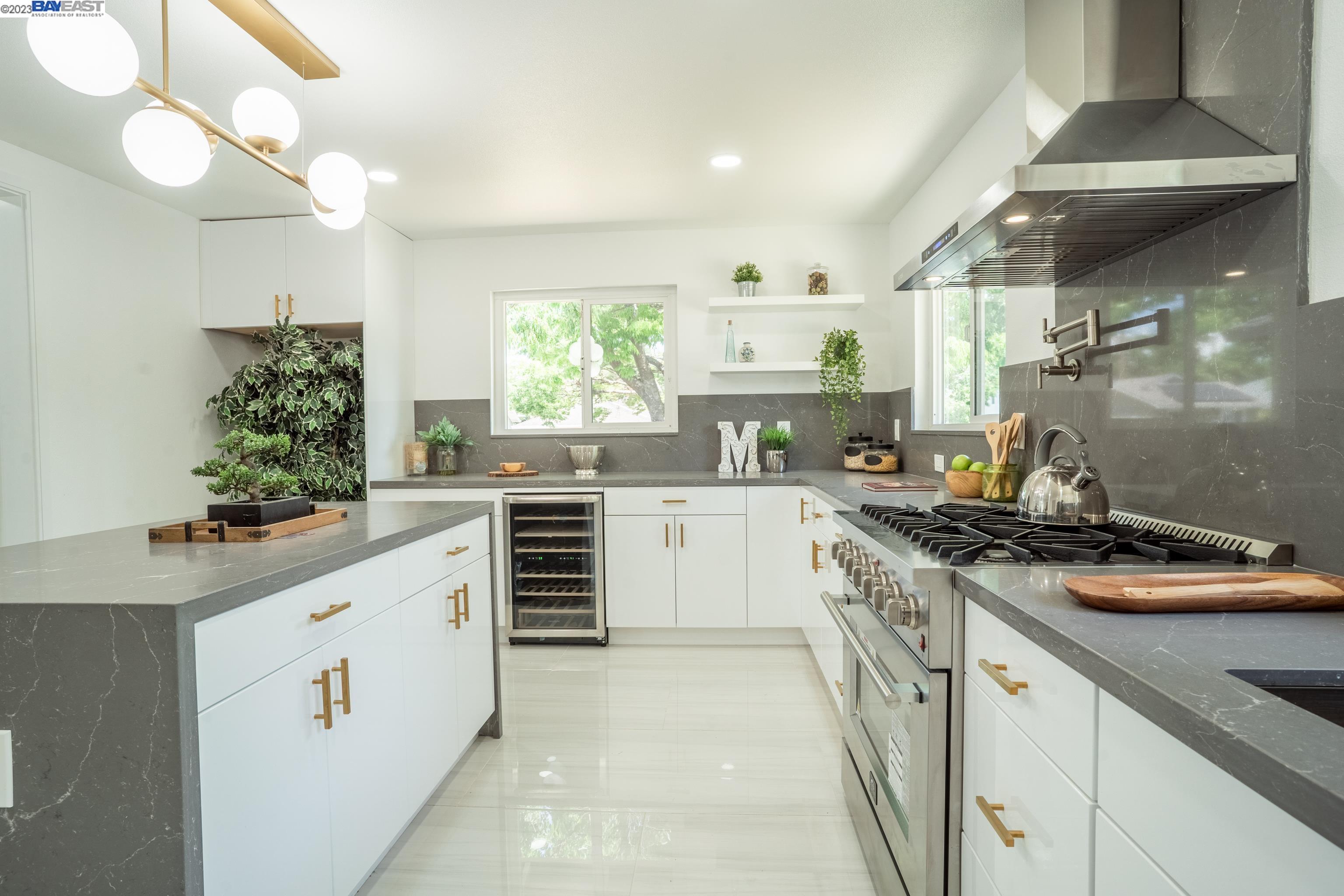 4815 Elester Drive San Jose, CA 95124 - Photo 1 of 1 a kitchen with a white stove top oven and white cabinets