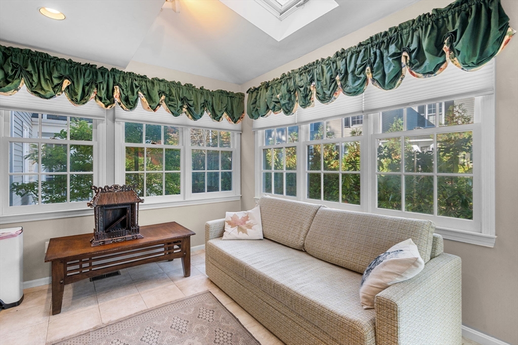 33 Pleasant Street, Unit 33 Manchester, MA 01944 - Photo 15 of 40 a living room with furniture and a large window