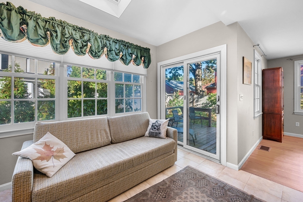 33 Pleasant Street, Unit 33 Manchester, MA 01944 - Photo 16 of 40 a living room with furniture and a large window