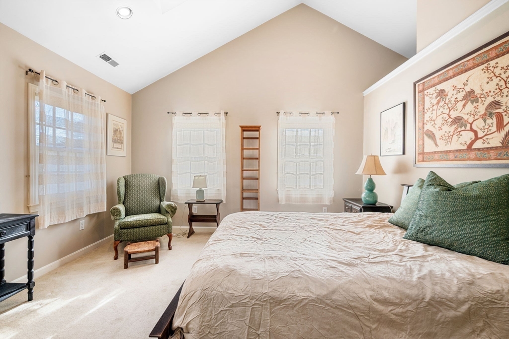 33 Pleasant Street, Unit 33 Manchester, MA 01944 - Photo 20 of 40 a bedroom with a bed and a large window