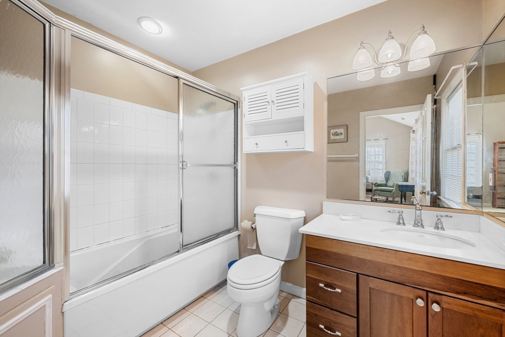 33 Pleasant Street, Unit 33 Manchester, MA 01944 - Photo 21 of 40 a bathroom with a sink a toilet and shower