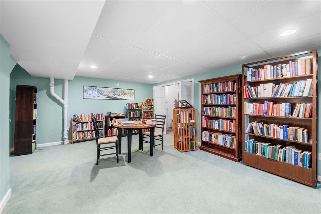 33 Pleasant Street, Unit 33 Manchester, MA 01944 - Photo 31 of 40 a view of a livingroom with furniture and workspace