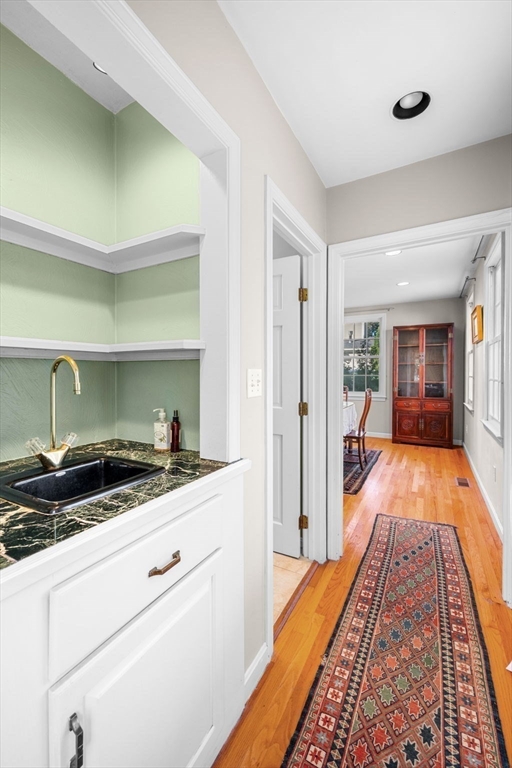 33 Pleasant Street, Unit 33 Manchester, MA 01944 - Photo 4 of 40 a very nice looking room with wooden floor and furniture