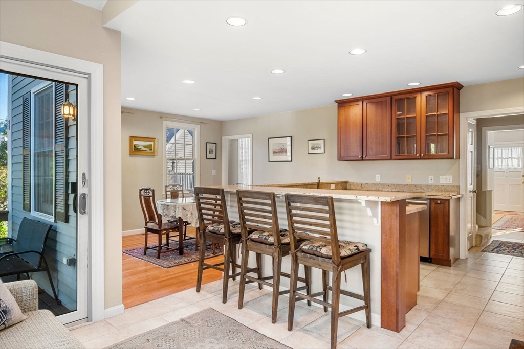 33 Pleasant Street, Unit 33 Manchester, MA 01944 - Photo 6 of 40 a view of a dining room with furniture