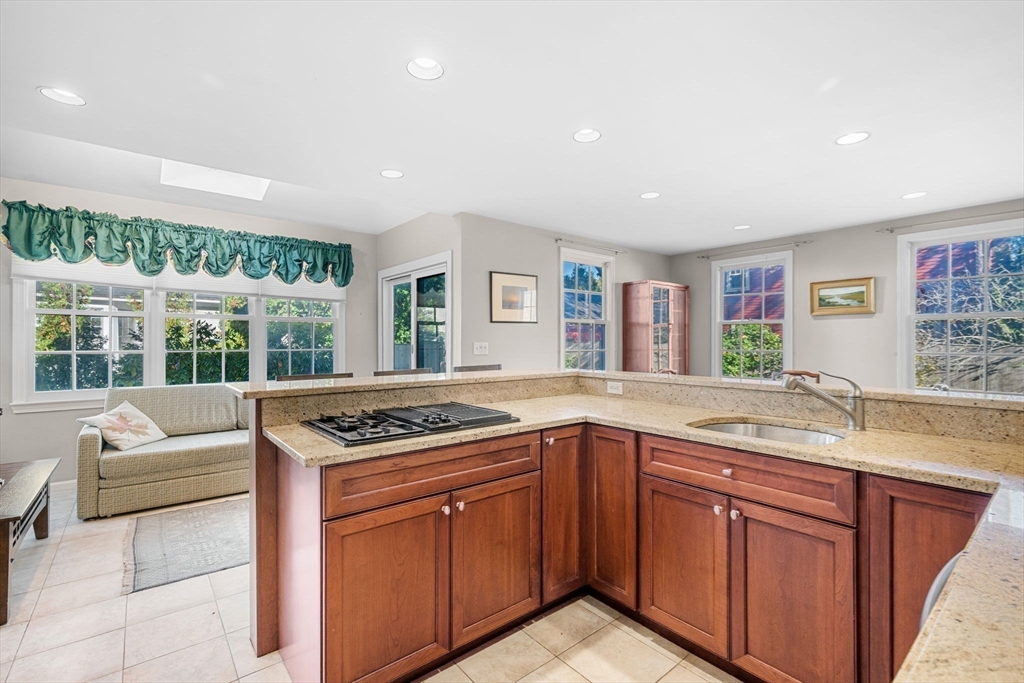 33 Pleasant Street, Unit 33 Manchester, MA 01944 - Photo 7 of 40 a kitchen with a sink and a large window