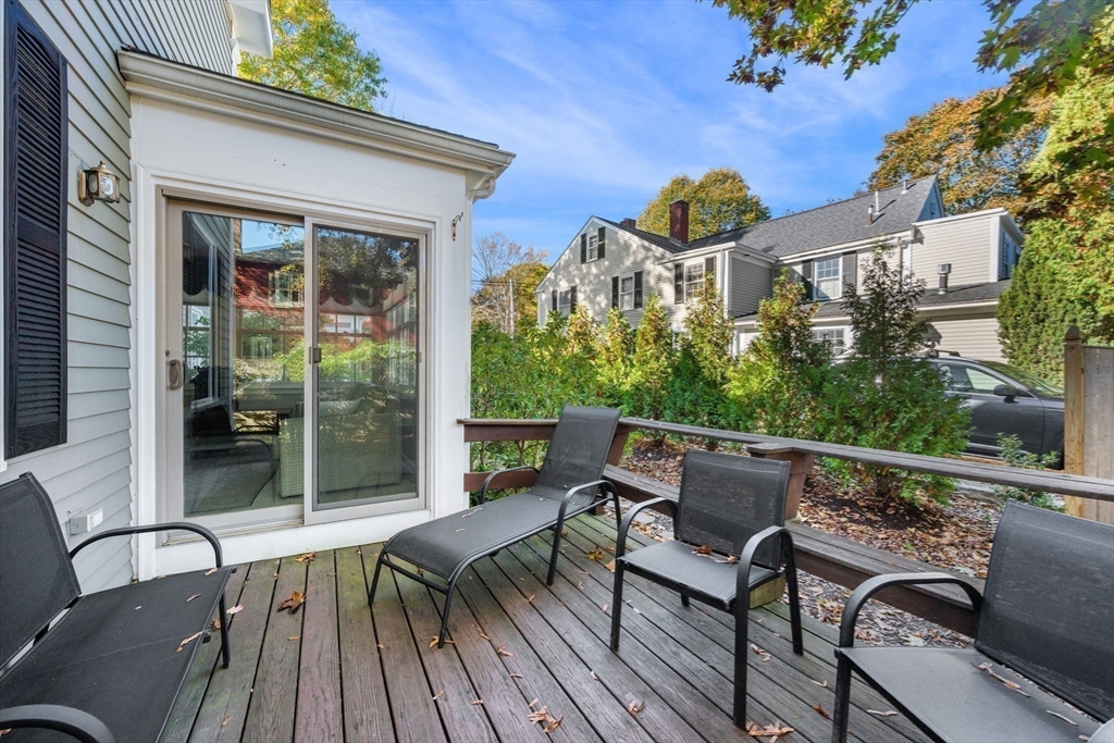 33 Pleasant Street, Unit 33 Manchester, MA 01944 - Photo 9 of 40 a view of a chairs and table in the balcony