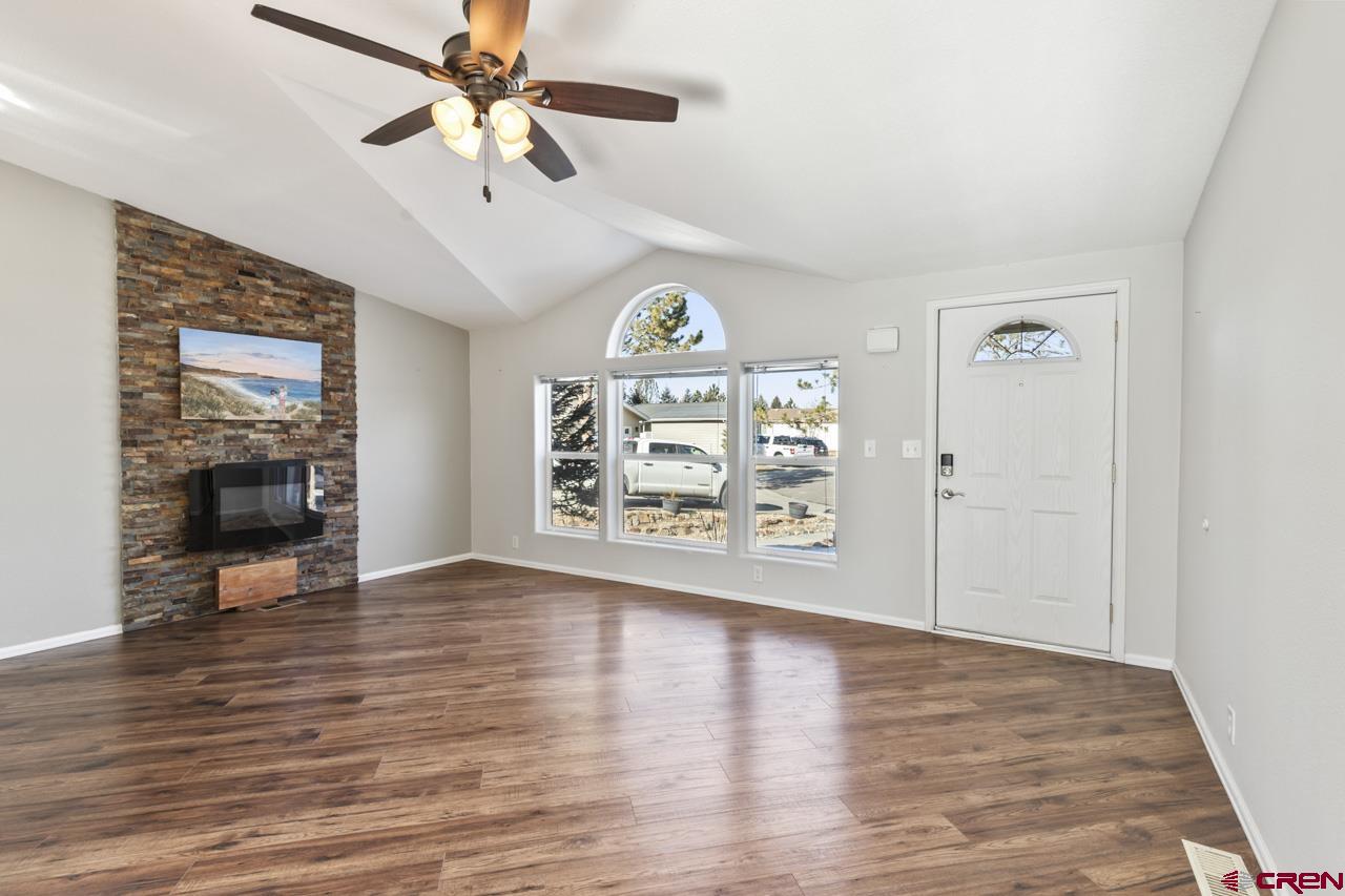 901 6530 Road, Unit 1312 Montrose, CO 81401 - Photo 29 of 30 a view of an empty room with a window and wooden floor