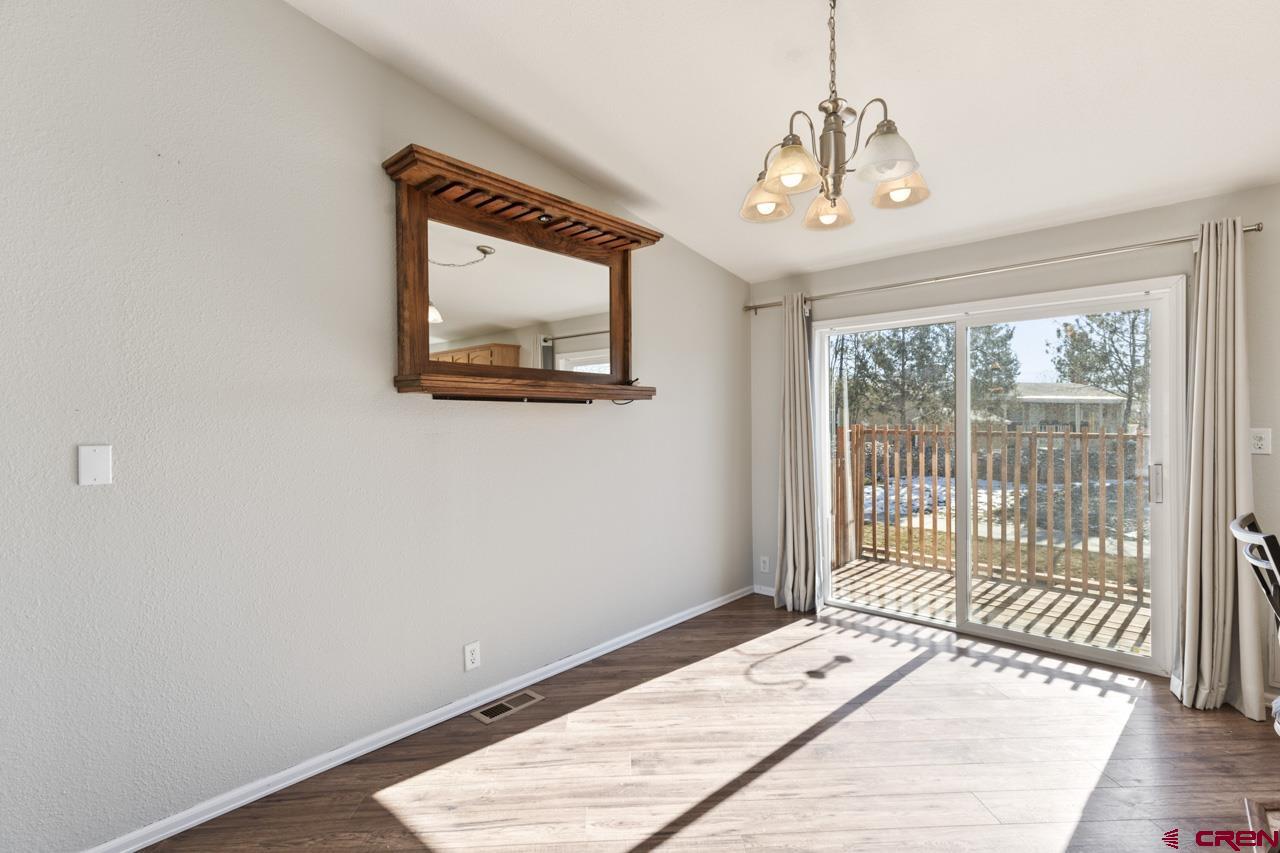 901 6530 Road, Unit 1312 Montrose, CO 81401 - Photo 3 of 30 a bedroom with a bed and a window