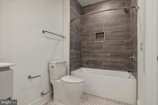 a bathroom with a sink a toilet and vanity