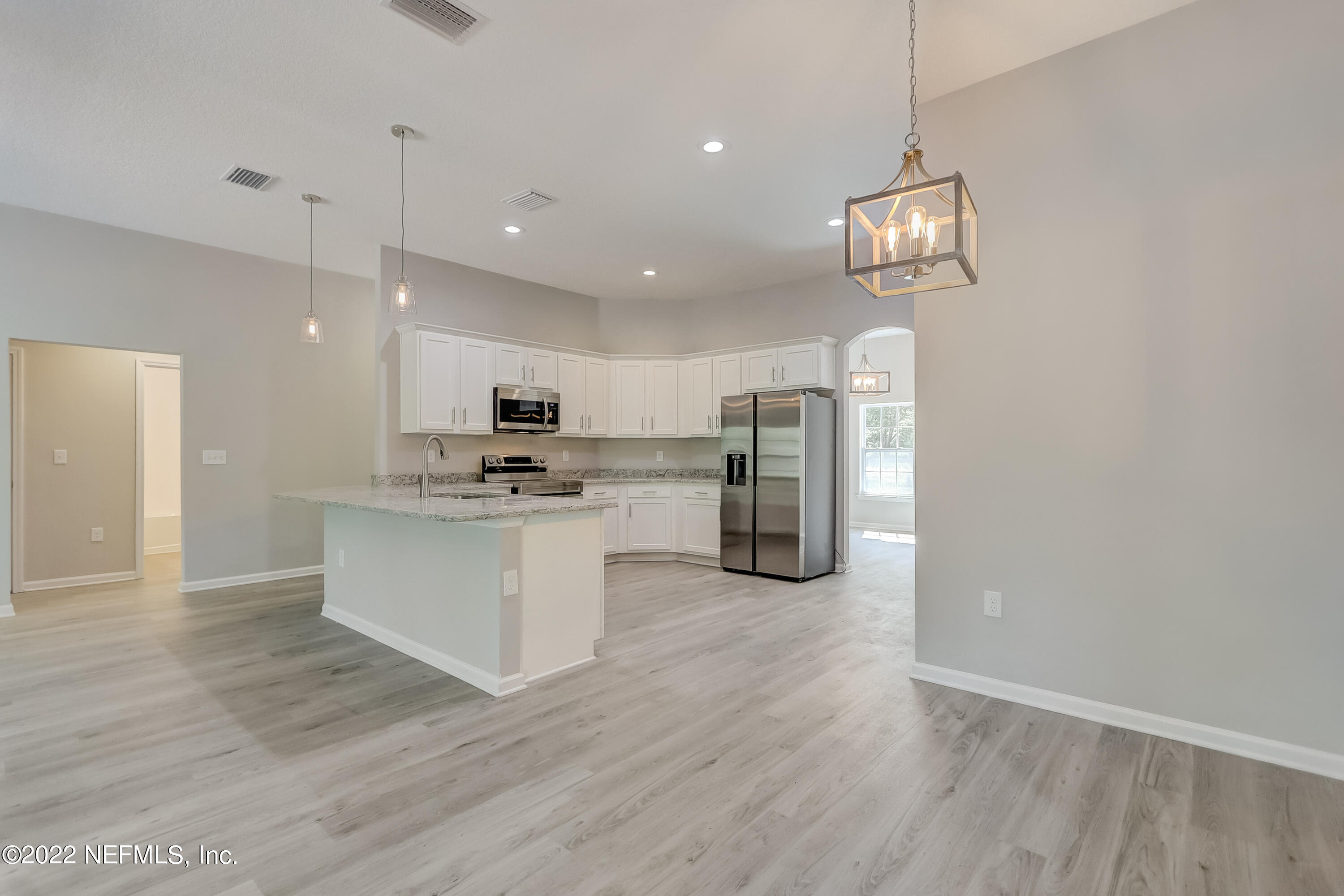 1187 Hatcher Road Middleburg, FL 32068 - Photo 21 of 42 a view of kitchen with refrigerator microwave and stove