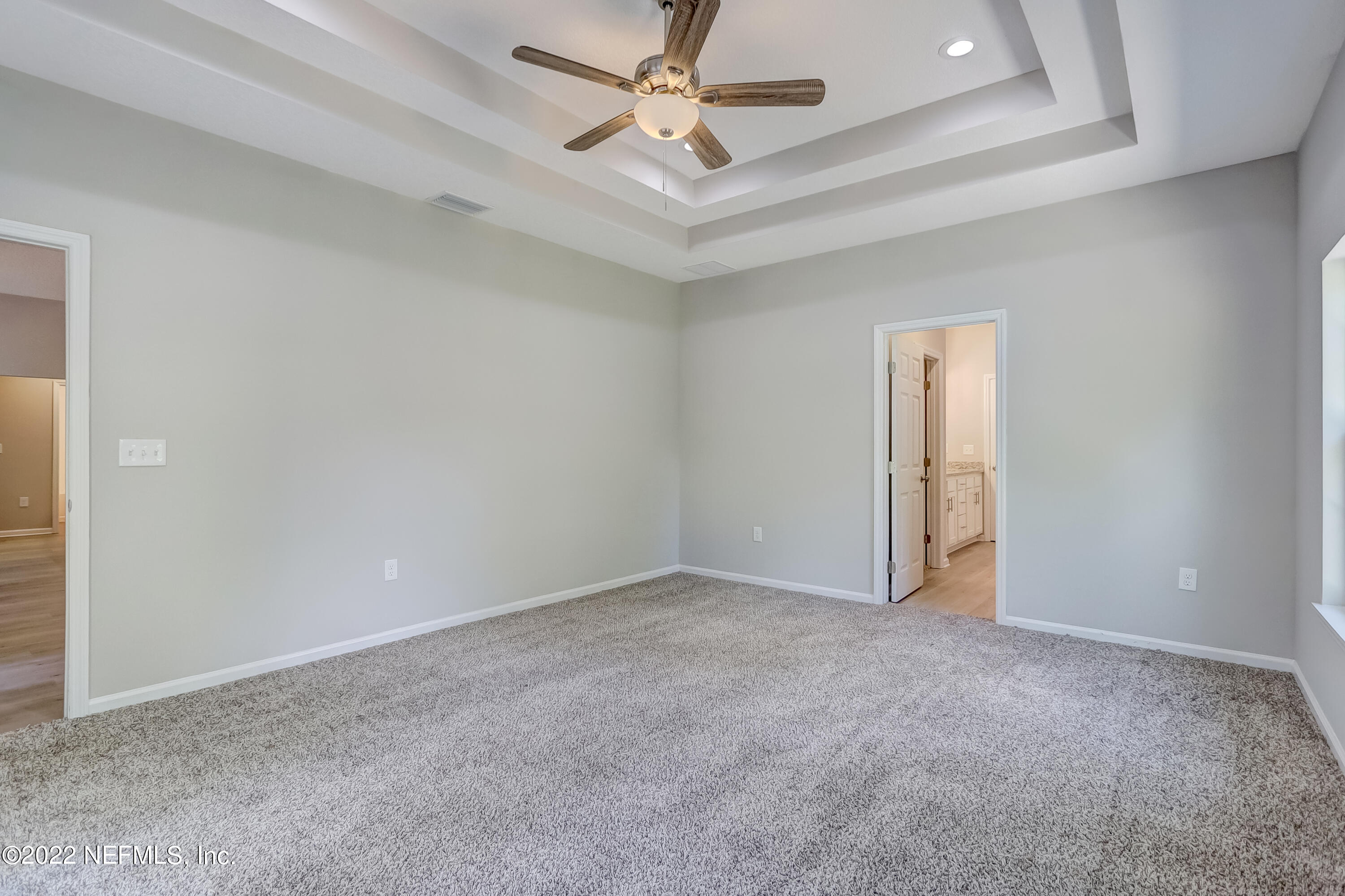 1187 Hatcher Road Middleburg, FL 32068 - Photo 27 of 42 an empty room with closet and a ceiling fan