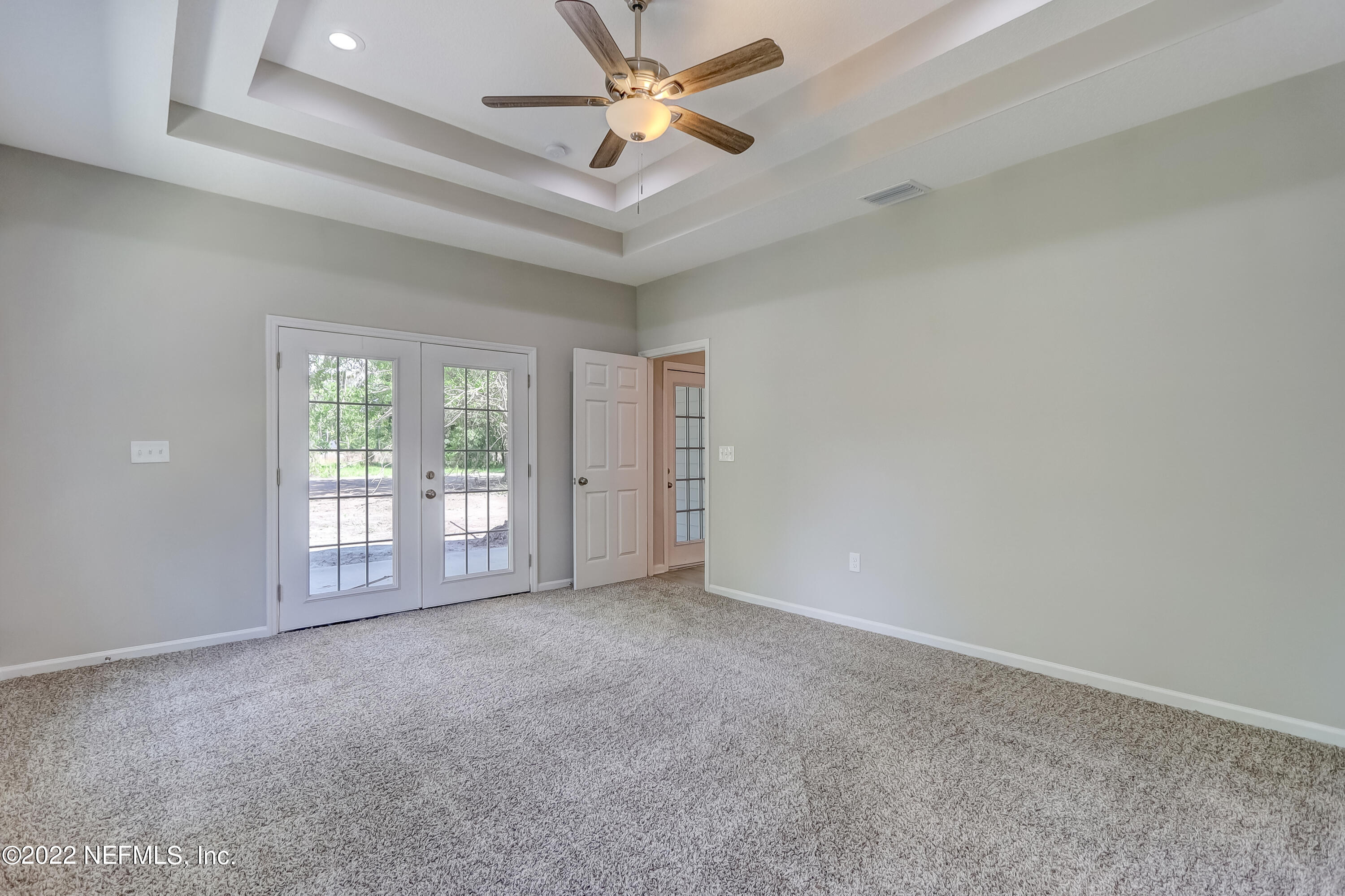 1187 Hatcher Road Middleburg, FL 32068 - Photo 28 of 42 a view of an empty room with chandelier fan and window