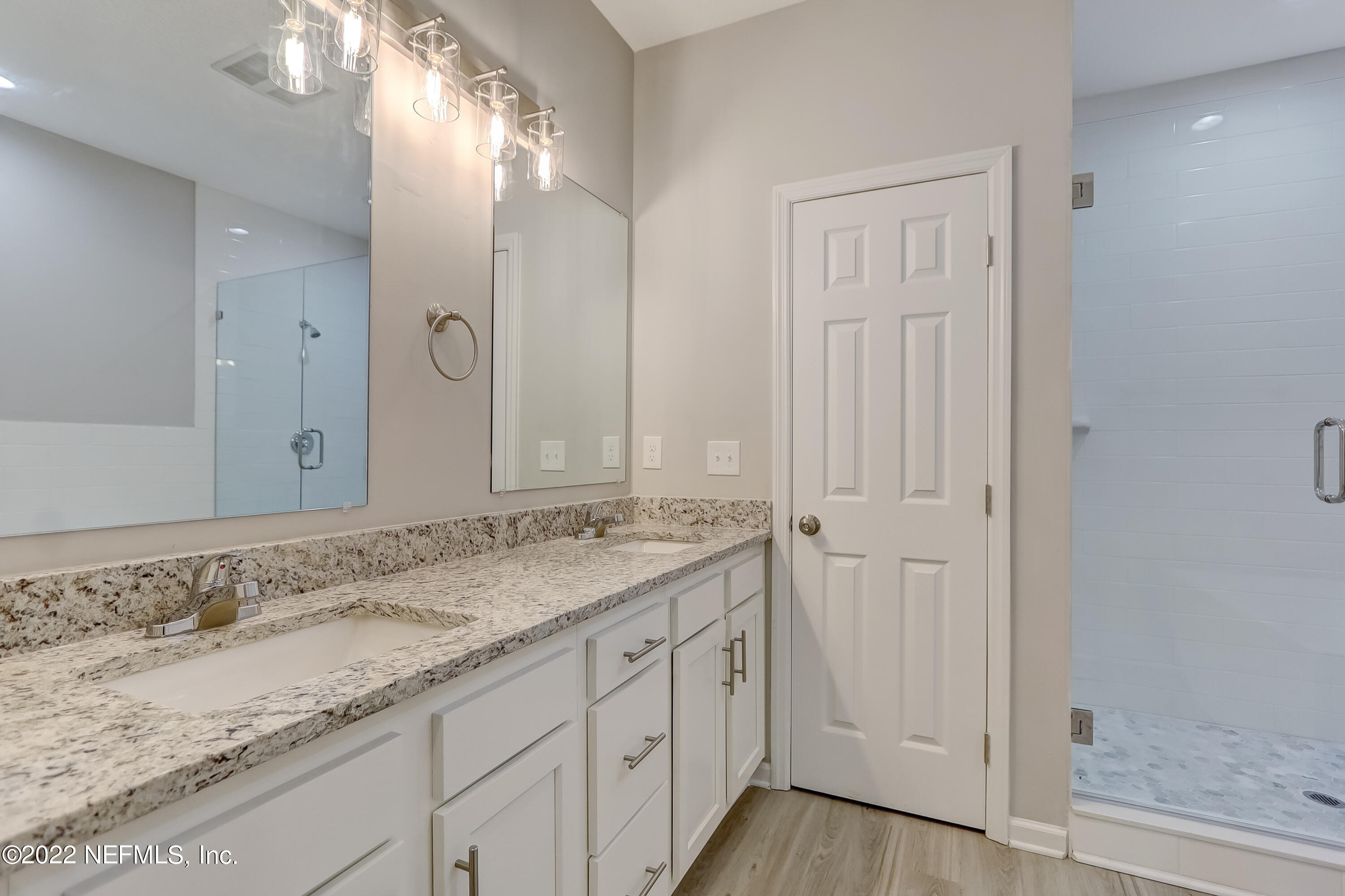 1187 Hatcher Road Middleburg, FL 32068 - Photo 30 of 42 a bathroom with a granite countertop sink and a mirror