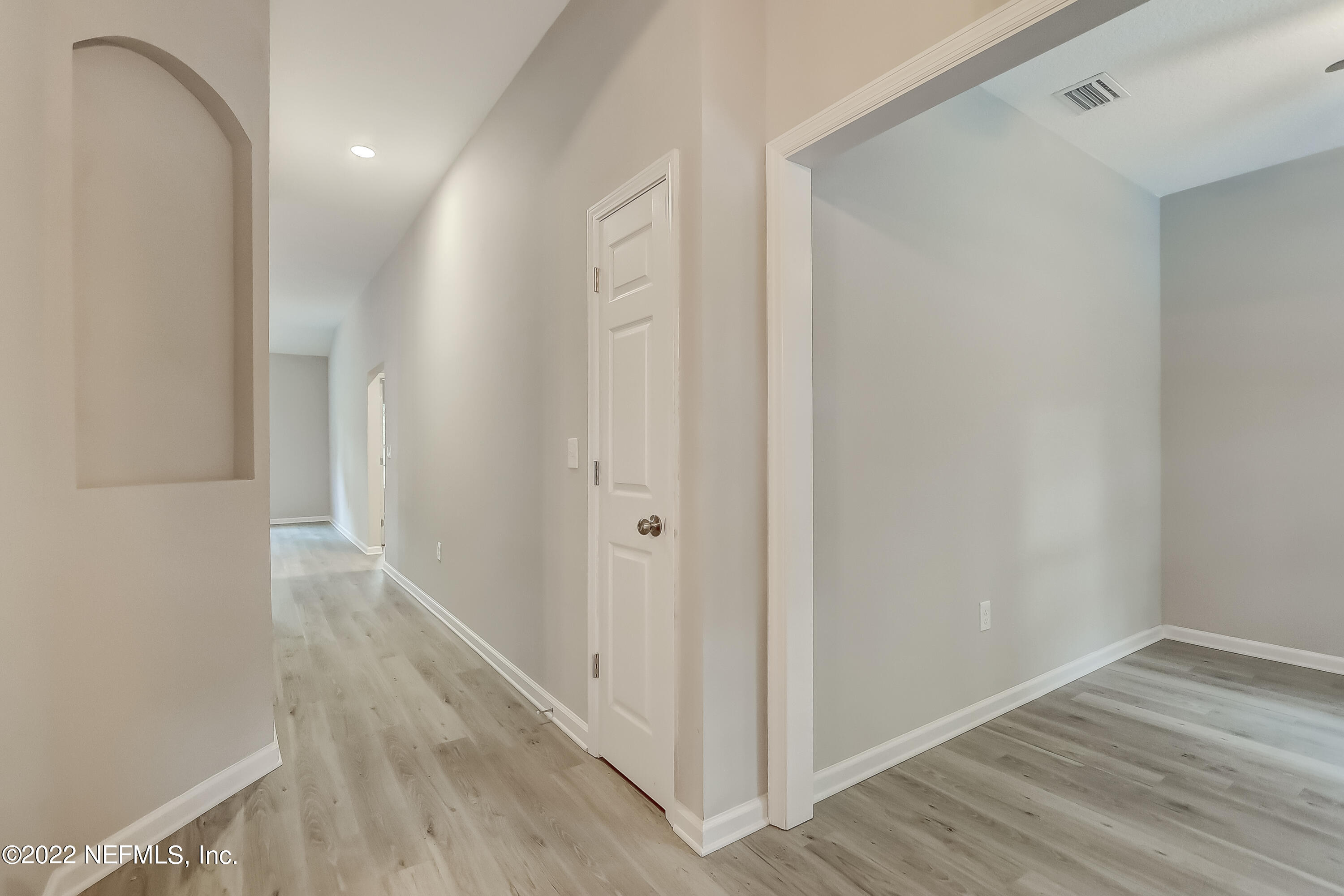 1187 Hatcher Road Middleburg, FL 32068 - Photo 3 of 42 a view of a hallway with wooden floor