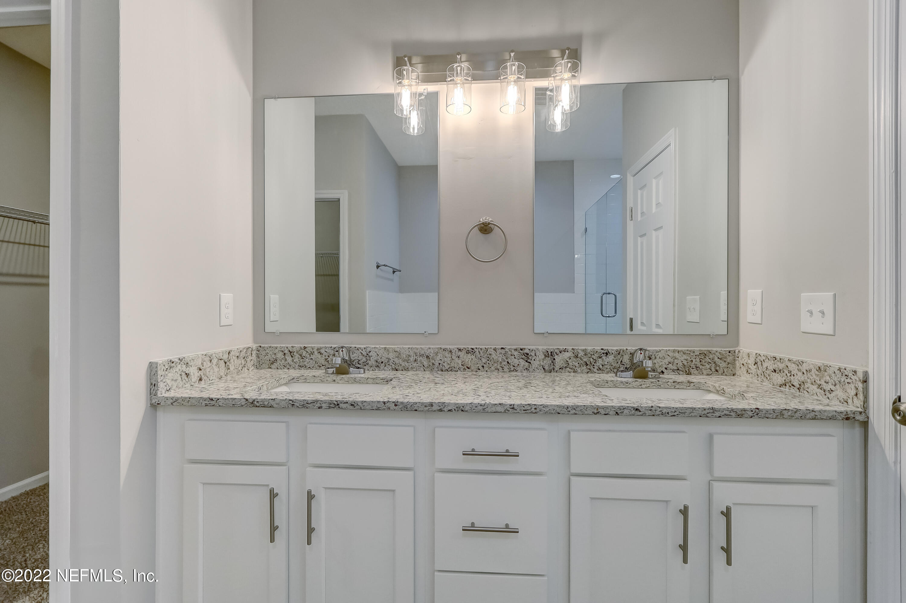 1187 Hatcher Road Middleburg, FL 32068 - Photo 31 of 42 a bathroom with a sink and a mirror