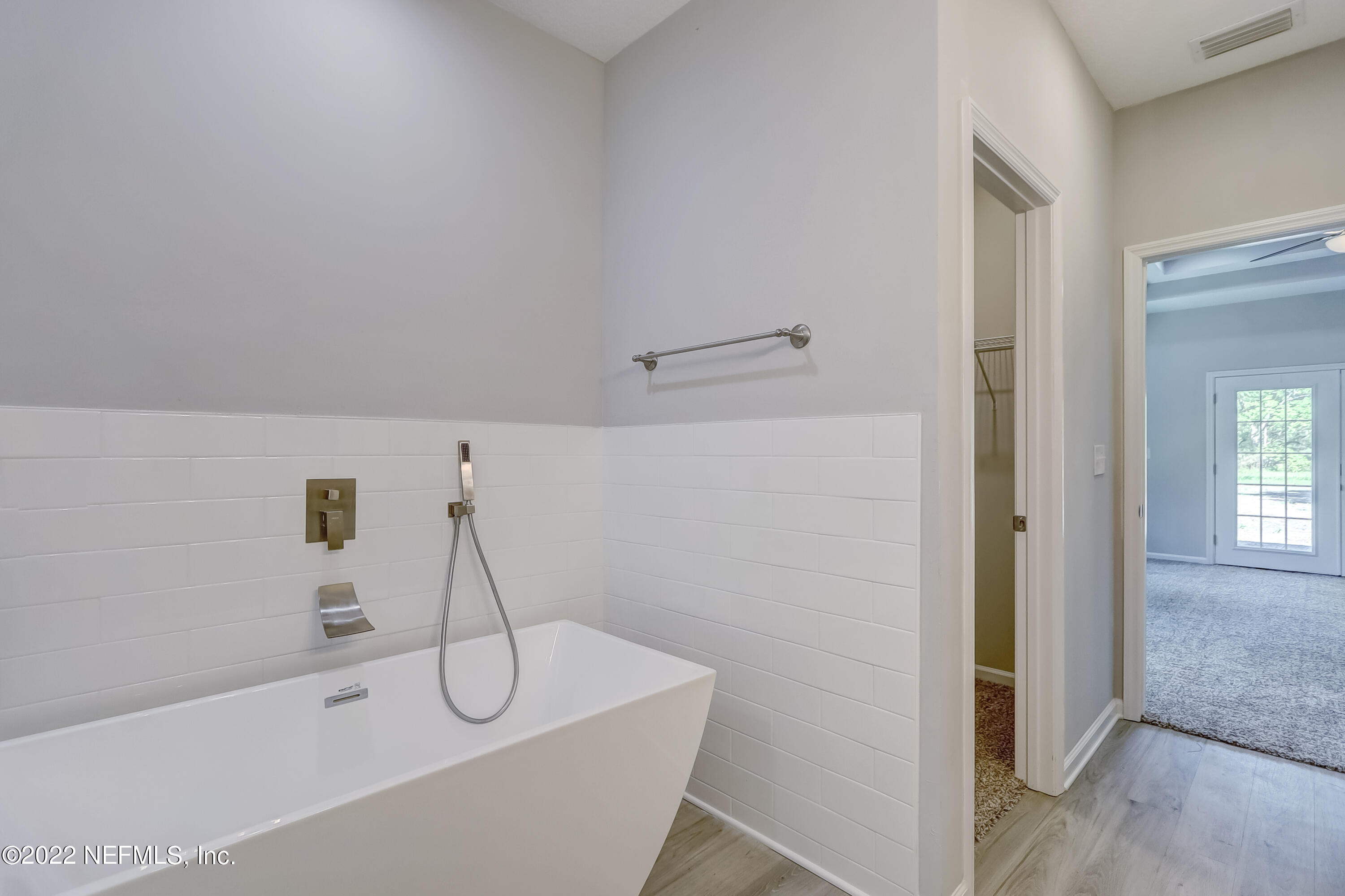 1187 Hatcher Road Middleburg, FL 32068 - Photo 33 of 42 a bathroom with a bathtub