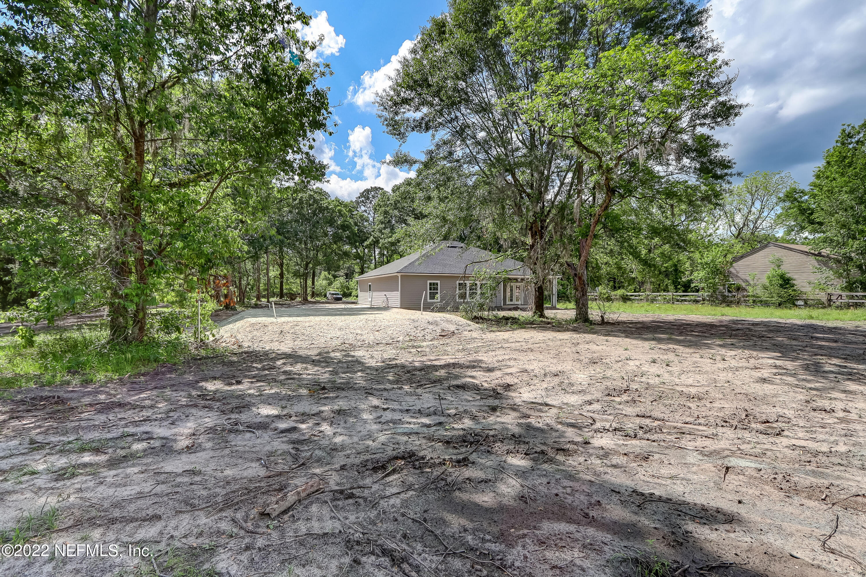 1187 Hatcher Road Middleburg, FL 32068 - Photo 40 of 42 a house with trees in the background