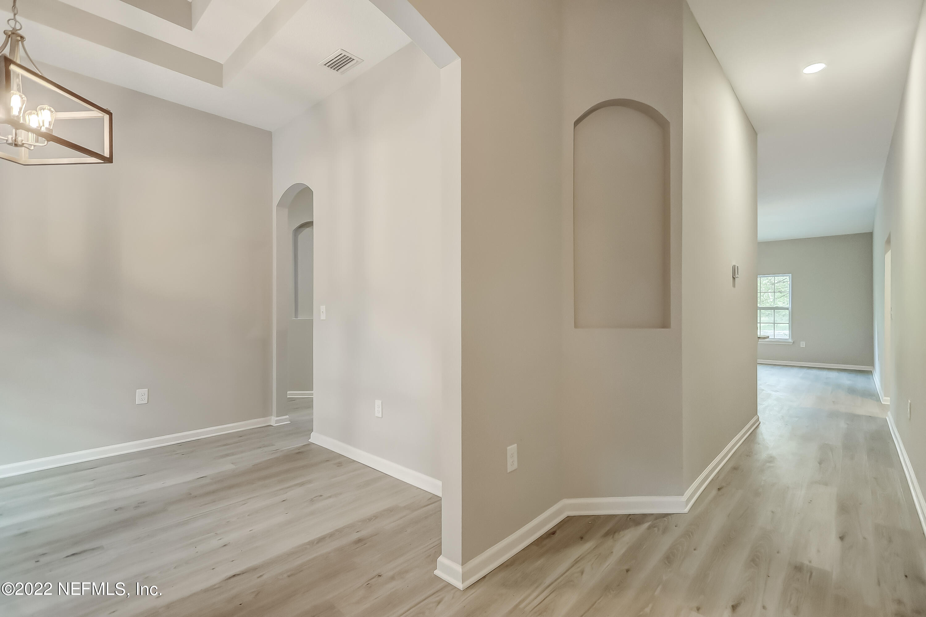 1187 Hatcher Road Middleburg, FL 32068 - Photo 4 of 42 a view of a room with wooden floor