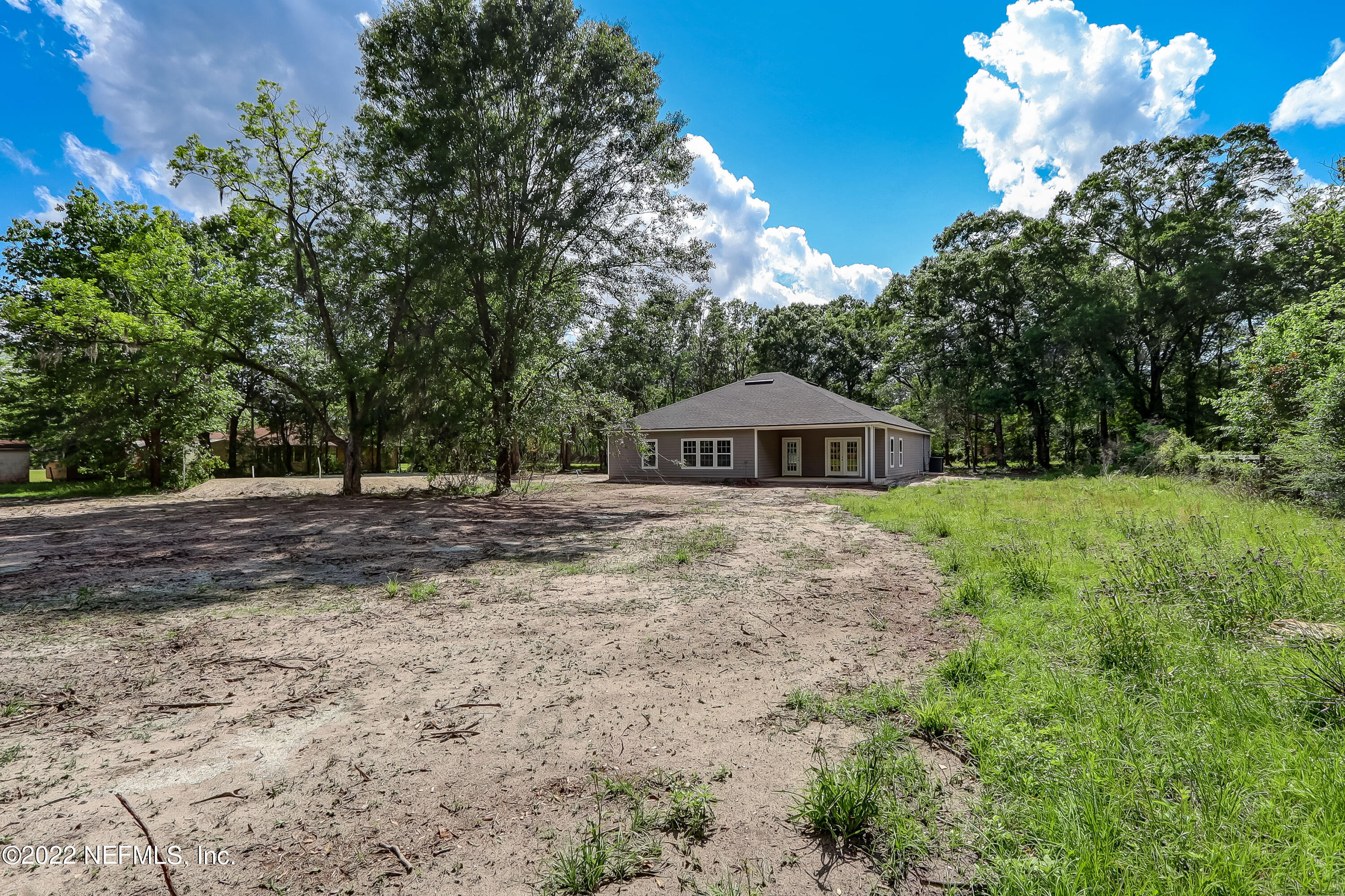 1187 Hatcher Road Middleburg, FL 32068 - Photo 41 of 42 a view of a house with a yard