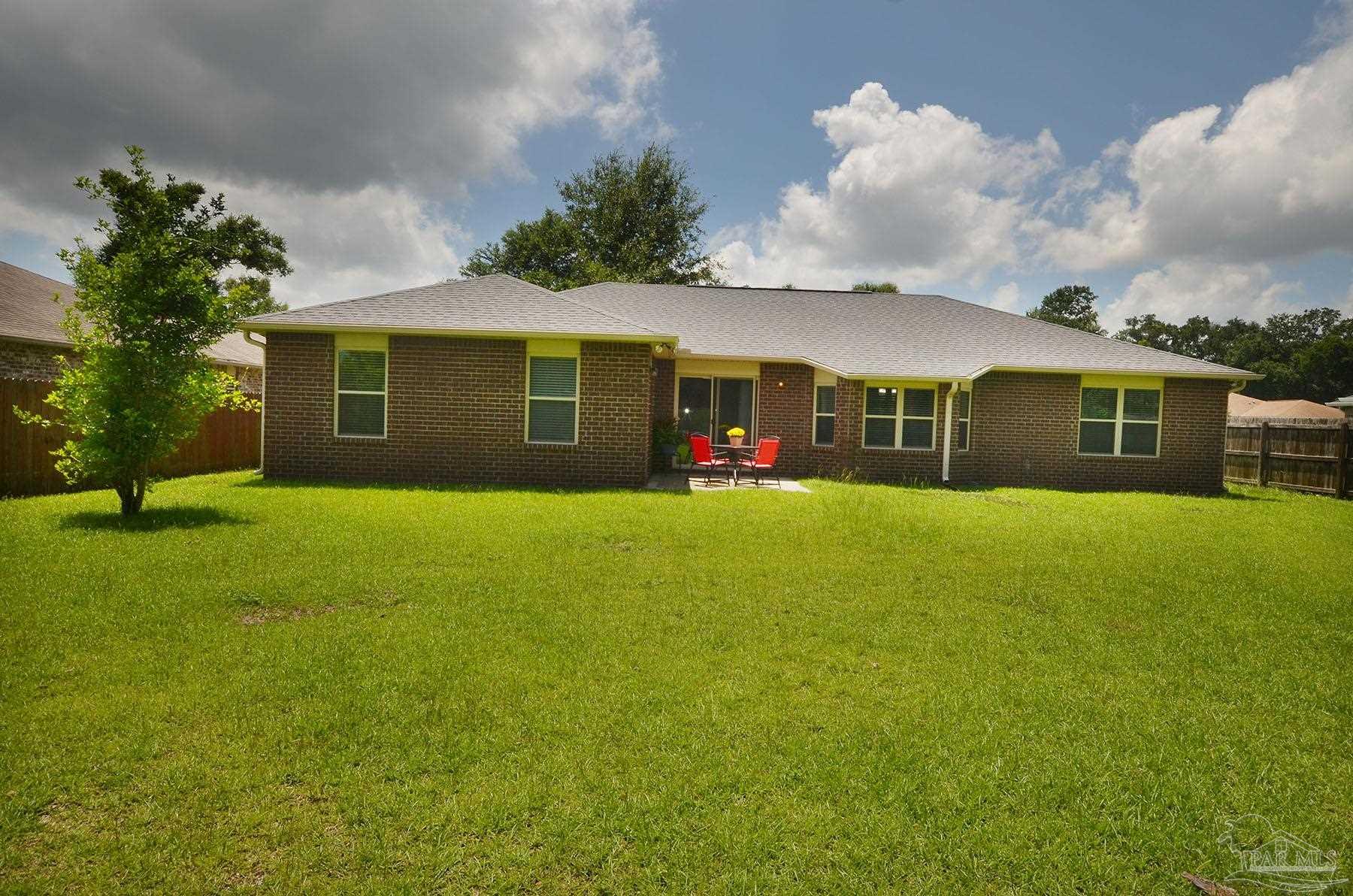 5709 Mill Stream Way Pace, FL 32571 - Photo 44 of 48 a view of a house with a big yard