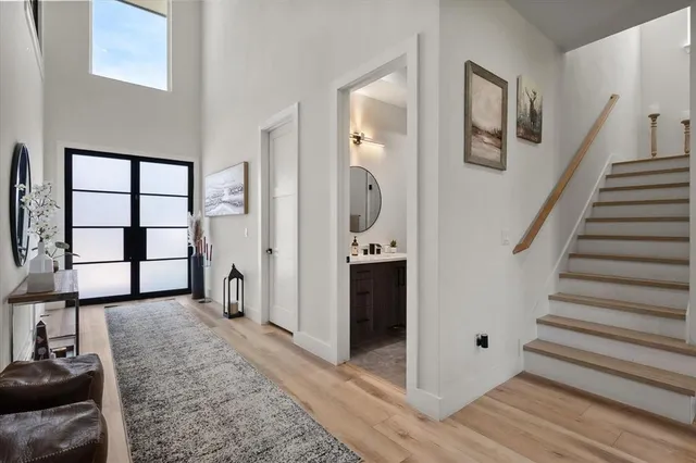 a view of a livingroom with furniture and staircase