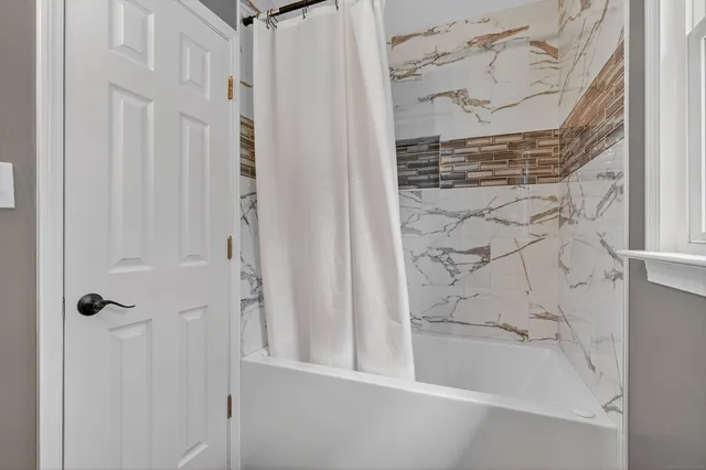 a bathroom with a bathtub