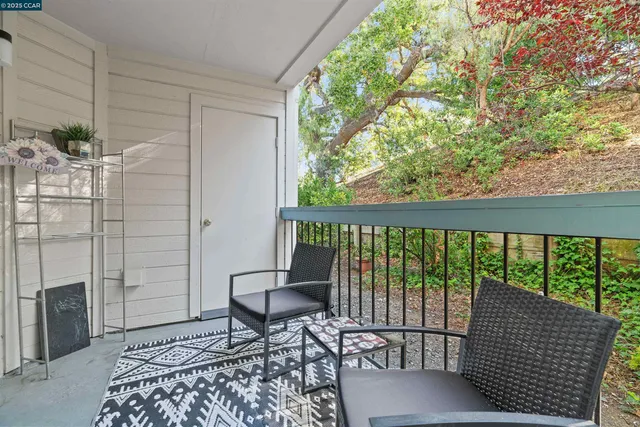 a balcony view with a couple of chairs